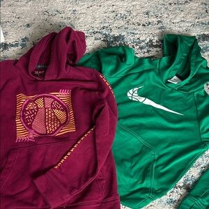 Green and Maroon Hoodies with basketball designs.